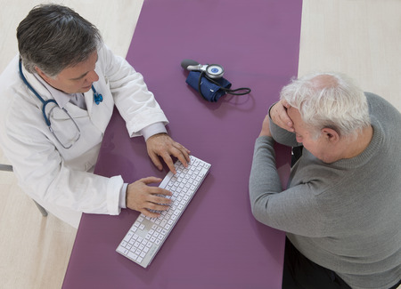 doctor discussing risk with senior patient